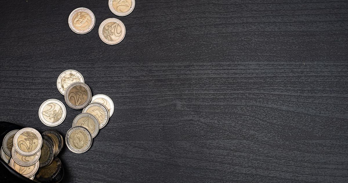 Euro coins on a dark surface