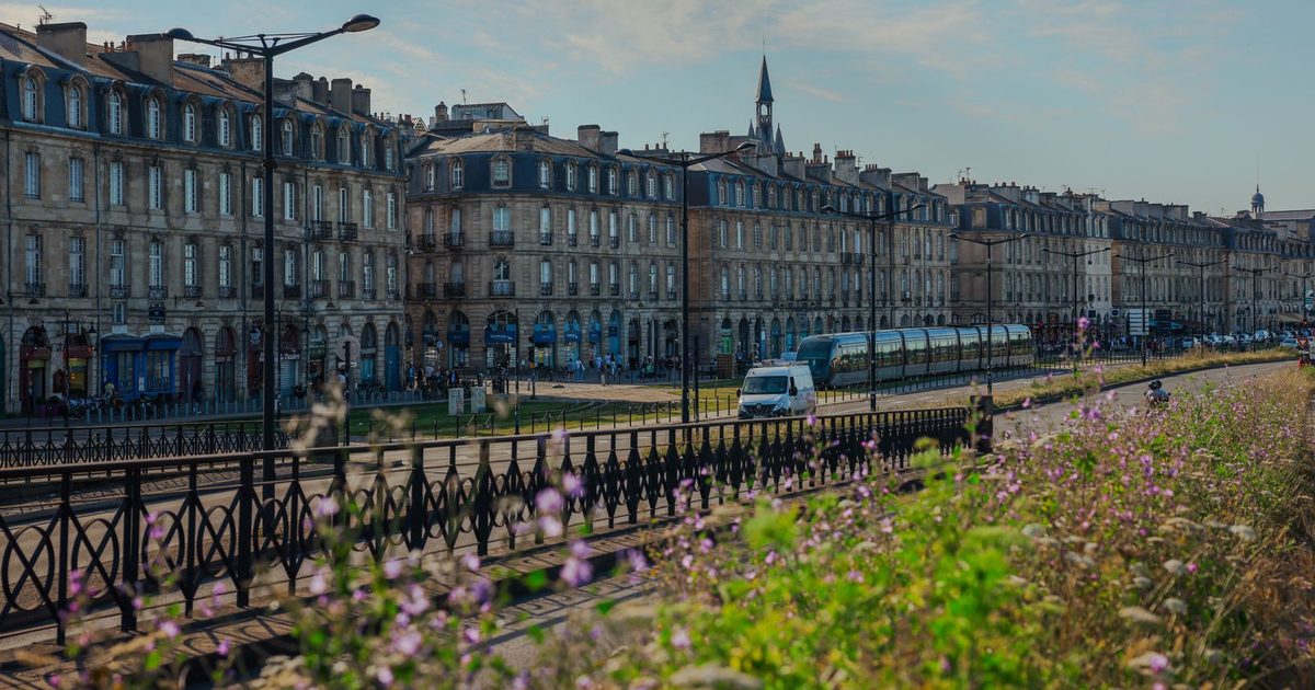 Historic buildings and a tram in Bordeaux, France