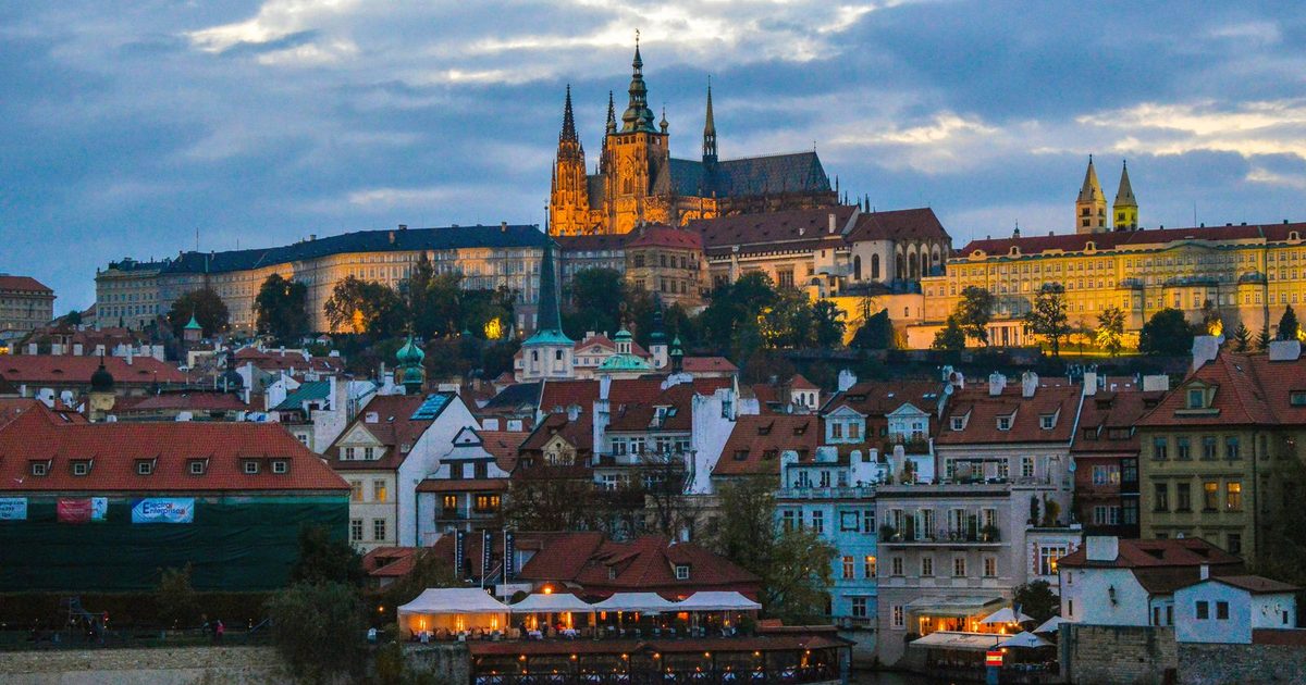 Prague Castle at twilight above the historic city