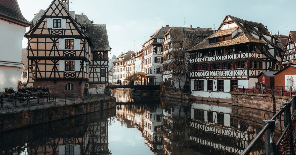 Half-timbered houses reflected in a canal, Strasbourg, France
